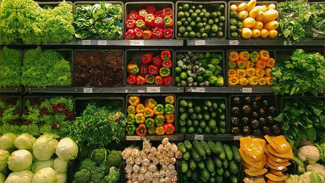 Fresh produced just delivered by cold chain logistics and displayed on shelves in a supermarket.
